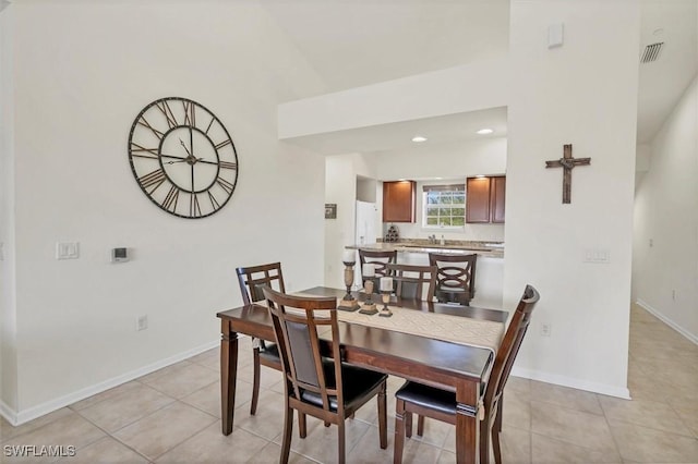 dining area featuring light tile patterned floors, visible vents, recessed lighting, and baseboards