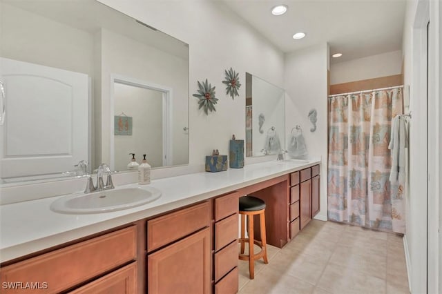 full bathroom with a sink, curtained shower, recessed lighting, tile patterned flooring, and double vanity