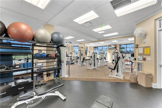 workout area featuring a drop ceiling