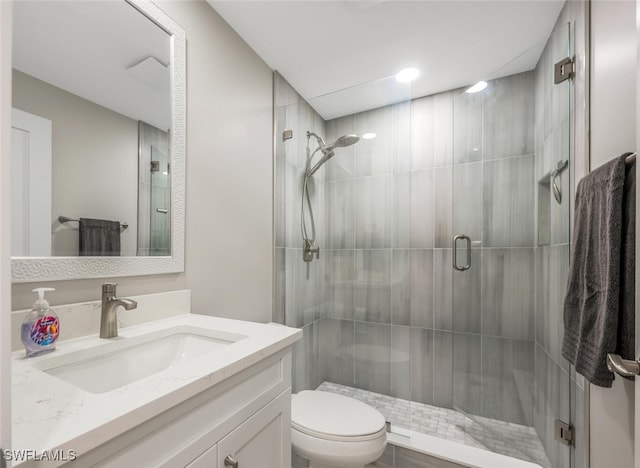 886 Tanbark Dr SW Unit 103, Naples, FL 34108 - bathroom with toilet, vanity, and a shower stall