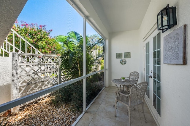 886 Tanbark Dr SW Unit 103, Naples, FL 34108 - sunroom featuring french doors