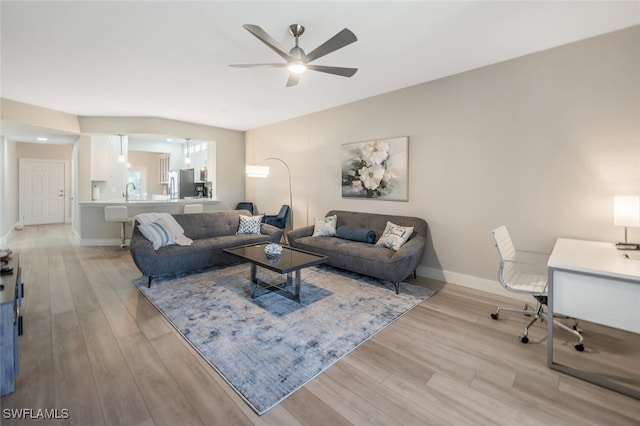 886 Tanbark Dr SW Unit 103, Naples, FL 34108 - living room featuring ceiling fan, light wood-style flooring, baseboards, and an office area