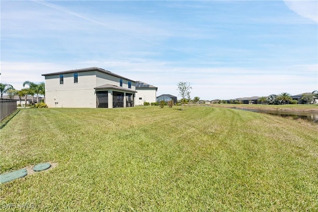 view of yard with a sunroom