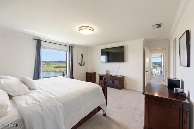 bedroom with ornamental molding, light colored carpet, visible vents, and multiple windows