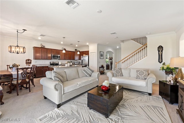 living area featuring arched walkways, crown molding, light colored carpet, visible vents, and stairs