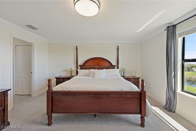 bedroom with light carpet, baseboards, visible vents, and ornamental molding