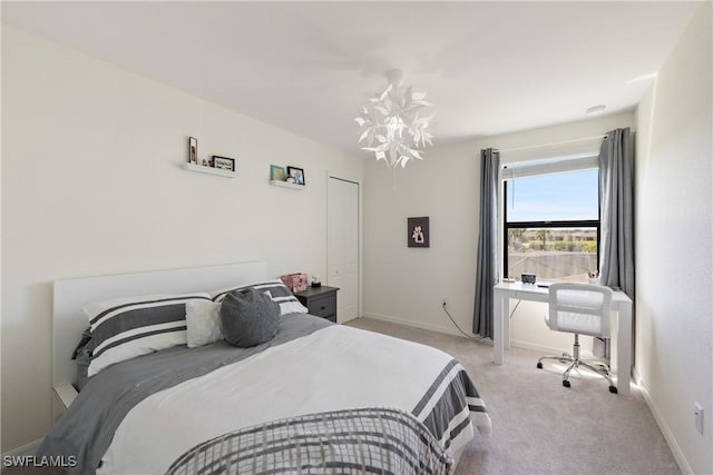 bedroom featuring baseboards and light colored carpet