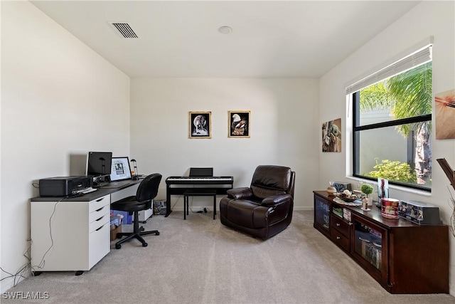 home office featuring visible vents and light colored carpet