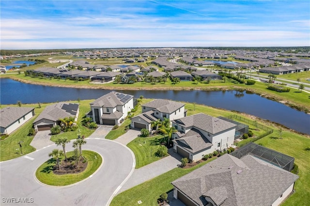 bird's eye view featuring a water view and a residential view