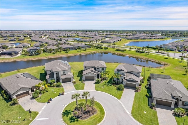 bird's eye view featuring a water view and a residential view