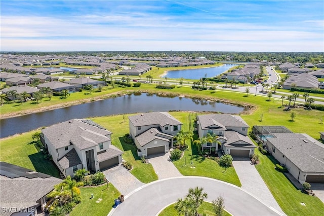 aerial view with a water view and a residential view