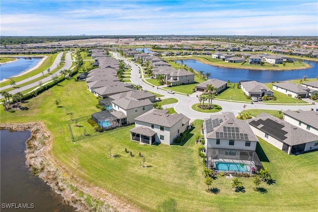 birds eye view of property featuring a water view and a residential view