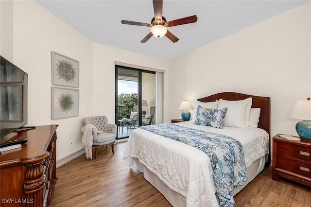 bedroom featuring ceiling fan, baseboards, wood finished floors, and access to exterior