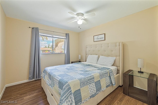 bedroom featuring ceiling fan, wood finished floors, and baseboards