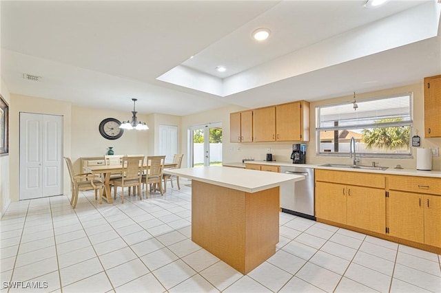 kitchen featuring a sink, light countertops, stainless steel dishwasher, and light tile patterned flooring