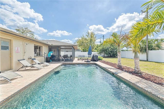 view of swimming pool featuring a yard, a patio area, a fenced backyard, and a fenced in pool