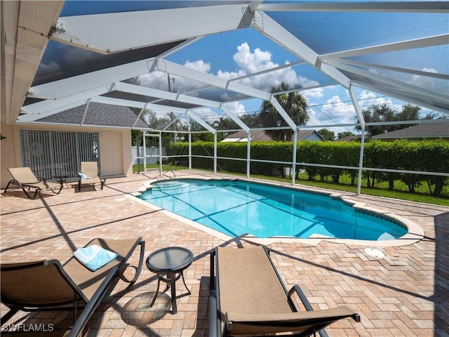 1822 SE 20th St, Cape Coral, FL 33990 - view of swimming pool featuring a patio, fence, a fenced in pool, and glass enclosure