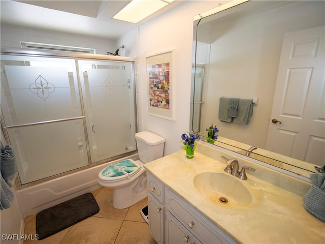 1822 SE 20th St, Cape Coral, FL 33990 - bathroom featuring toilet, tile patterned flooring, vanity, and combined bath / shower with glass door