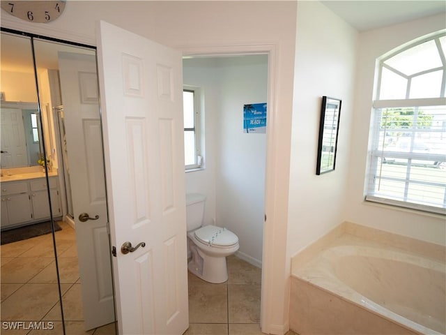 1822 SE 20th St, Cape Coral, FL 33990 - bathroom with vanity, toilet, a bath, and tile patterned floors