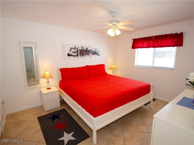 1822 SE 20th St, Cape Coral, FL 33990 - bedroom featuring light tile patterned floors, baseboards, and ceiling fan