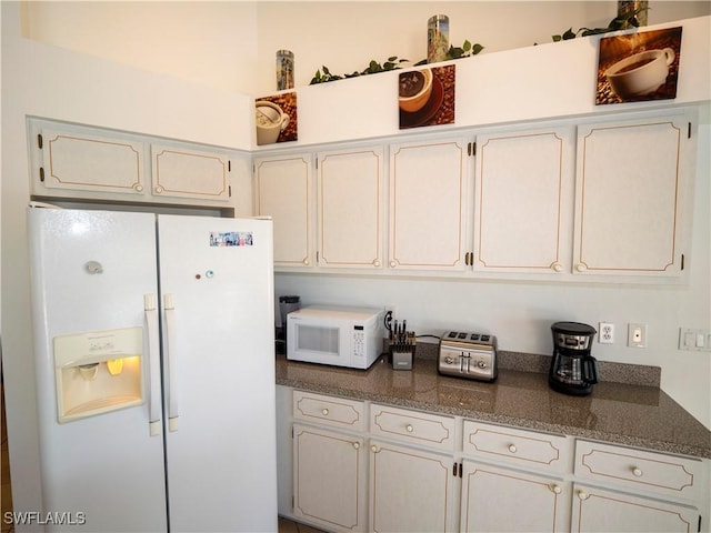 1822 SE 20th St, Cape Coral, FL 33990 - kitchen featuring white cabinetry, white appliances, and dark countertops