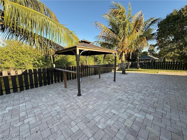 surrounding community with a gazebo, fence private yard, and a patio