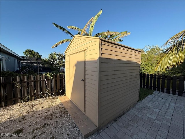 view of shed featuring a fenced backyard