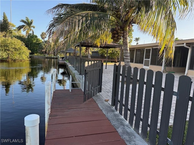 dock area with a water view