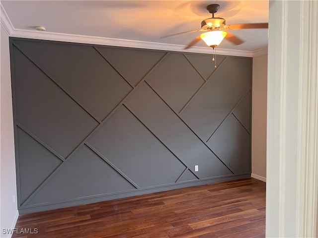 spare room featuring ceiling fan and wood finished floors