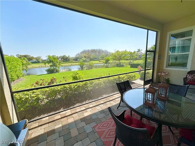 sunroom with a water view