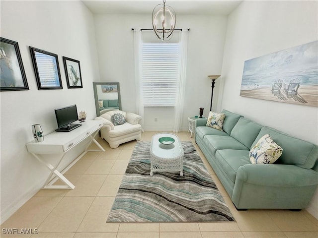 living area with baseboards, an inviting chandelier, and tile patterned flooring