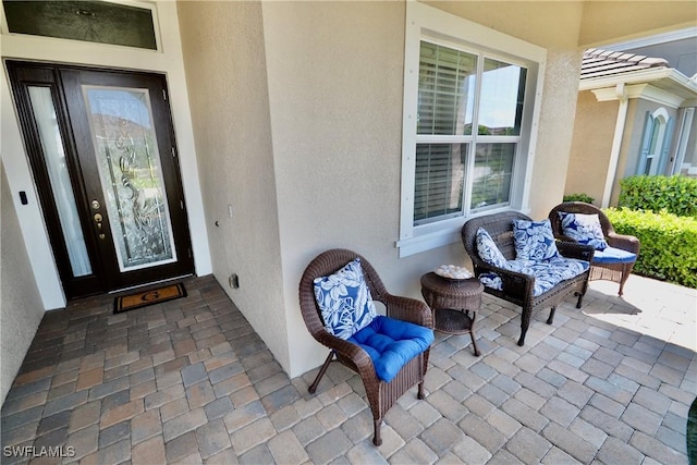 doorway to property with stucco siding