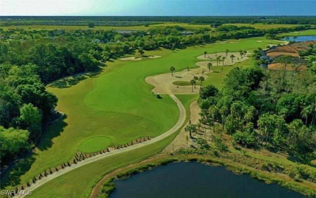 aerial view with golf course view and a water view