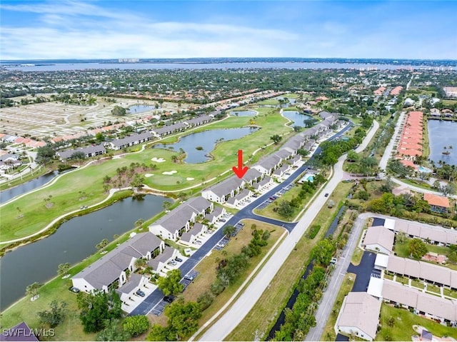 birds eye view of property featuring a residential view, view of golf course, and a water view