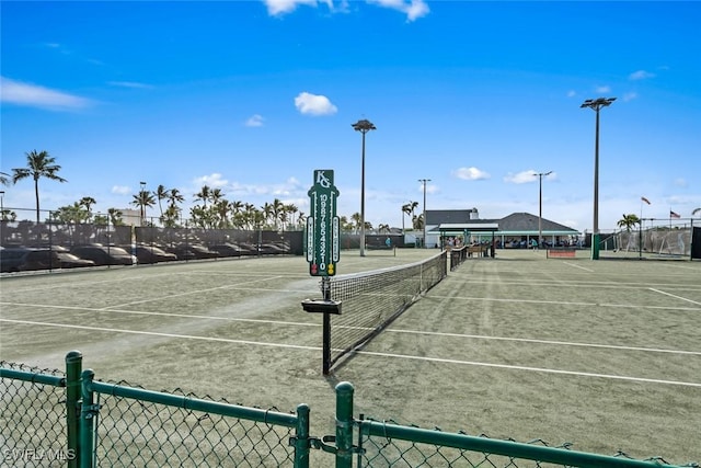 view of tennis court with fence