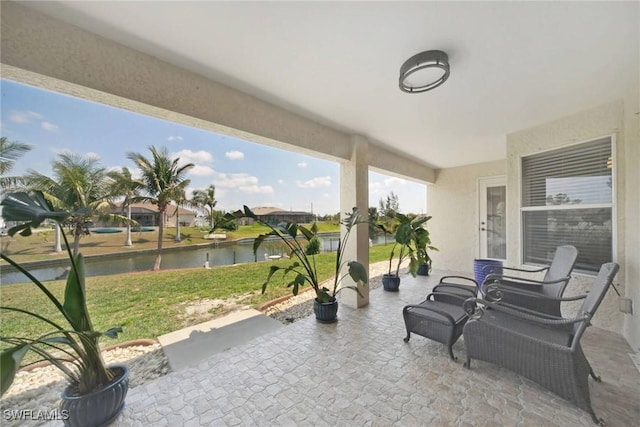 view of patio / terrace with a water view