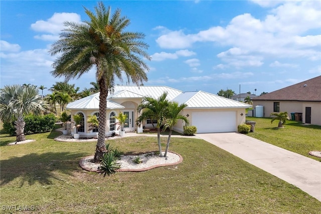 1727 NW 21st Pl, Cape Coral, FL 33993 - view of front facade featuring concrete driveway, stucco siding, metal roof, a garage, and a standing seam roof