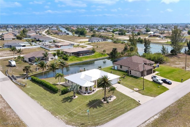 bird's eye view featuring a residential view and a water view