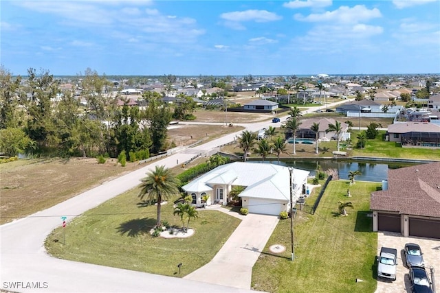 birds eye view of property with a residential view