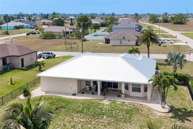 birds eye view of property with a residential view