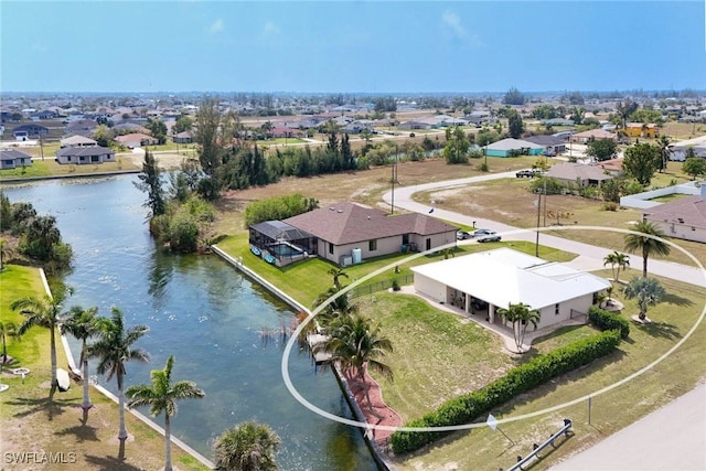 bird's eye view featuring a residential view and a water view