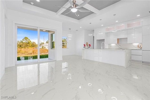 unfurnished living room featuring recessed lighting, marble finish floor, coffered ceiling, and ceiling fan