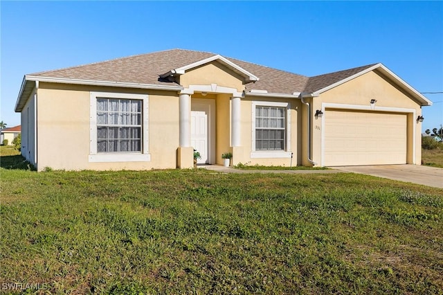 ranch-style home with a front lawn, an attached garage, and stucco siding