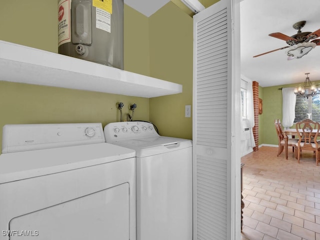 laundry room with laundry area, water heater, washer and clothes dryer, and ceiling fan with notable chandelier