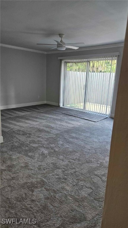 carpeted spare room featuring ceiling fan, baseboards, and ornamental molding