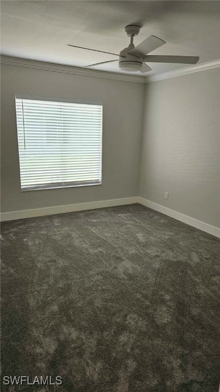 unfurnished room featuring crown molding, a ceiling fan, baseboards, and dark carpet