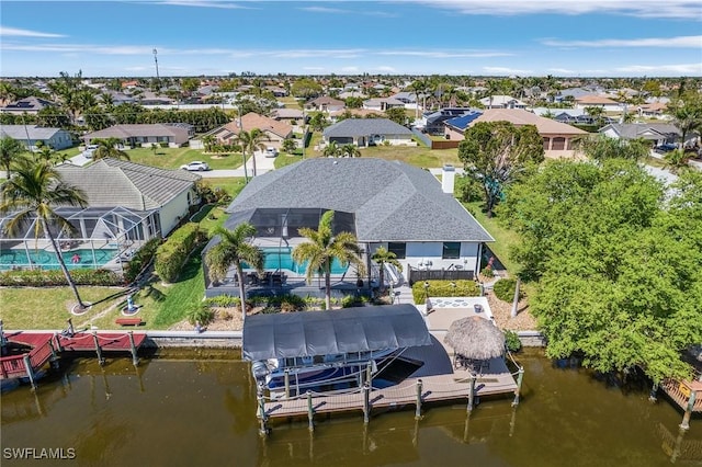 bird's eye view featuring a residential view and a water view