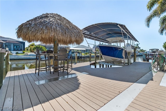 view of dock featuring a water view and boat lift