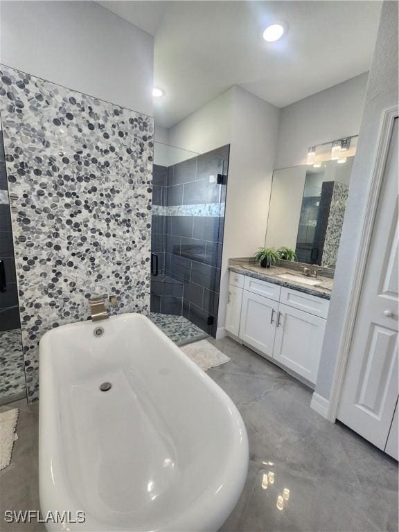 full bathroom with recessed lighting, a stall shower, vanity, and a freestanding tub