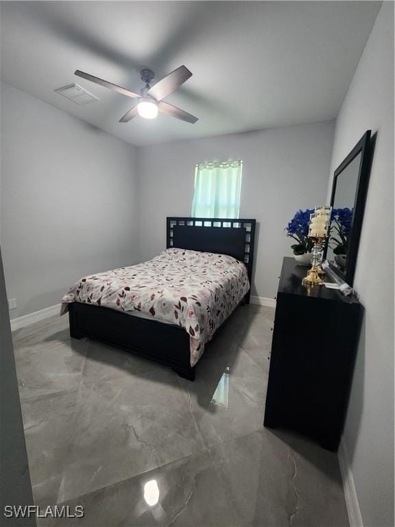 bedroom with visible vents, baseboards, and a ceiling fan